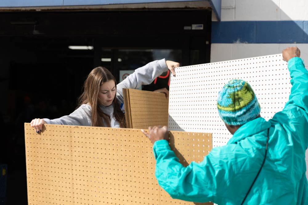 Students organize tack boards at Restore.
